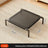 Elevated steel frame dog bed with black breathable mesh