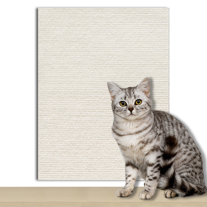 Cat scratching a flocked pad stuck to a wall