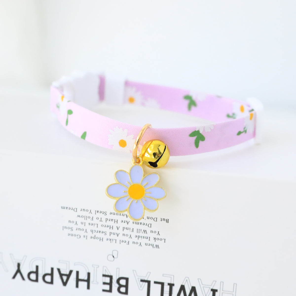 Floral cat collar with bell and safety buckle in Pink, side view