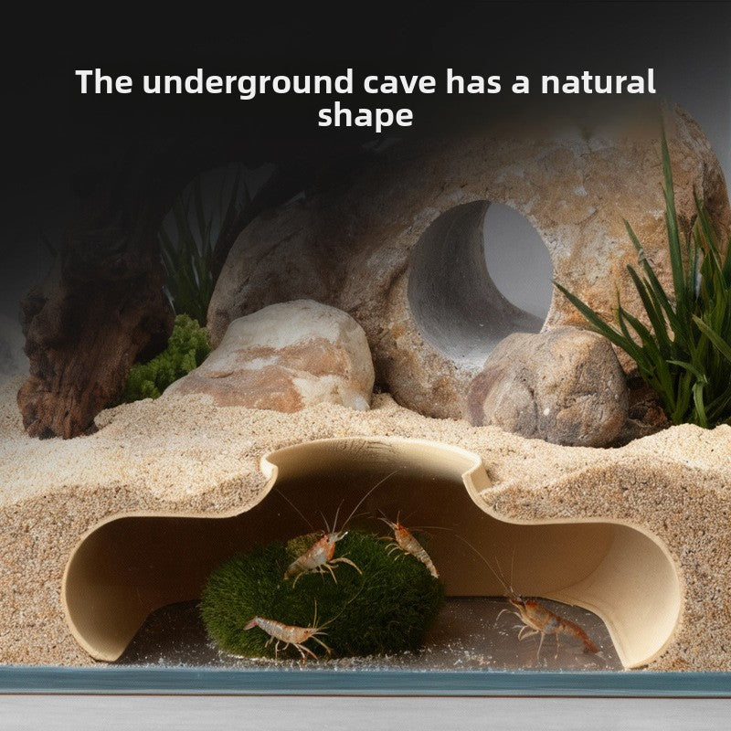 Small fish sheltering in an aquarium hiding cave