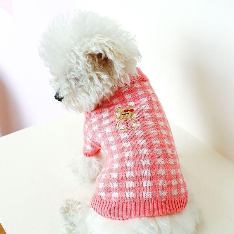 High collar knitted pet vest with floral embroidery, in use with a pet