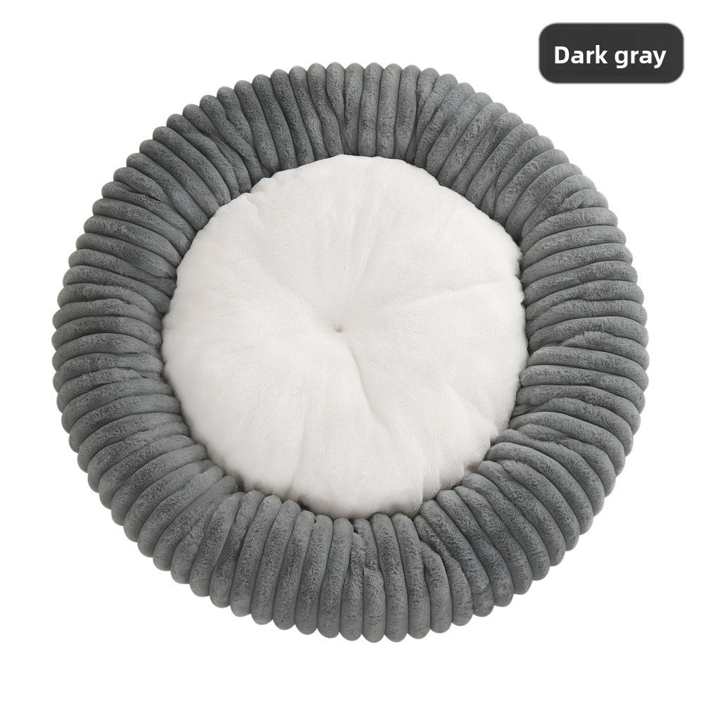 Small dog curled up in a khaki striped faux fur bed