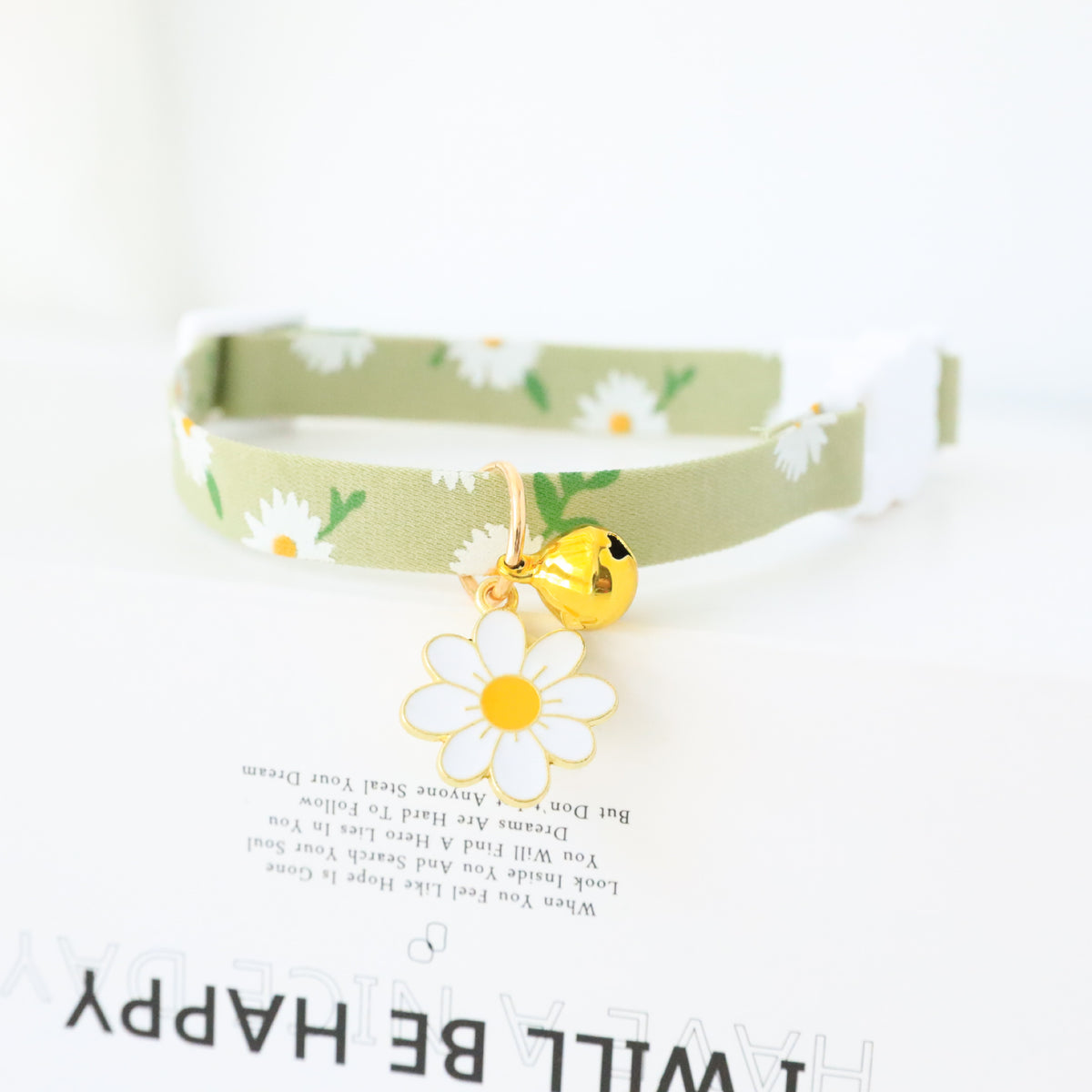 Floral cat collar with bell and safety buckle in Purple, close-up detail