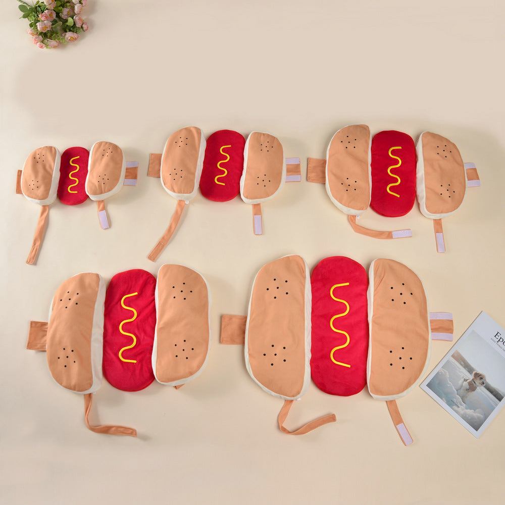 Small dog dressed in a funny frankfurter jacket costume