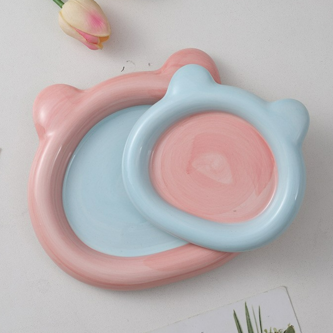 Glazed ceramic pet food plate with bear design in blue and pink, view 3