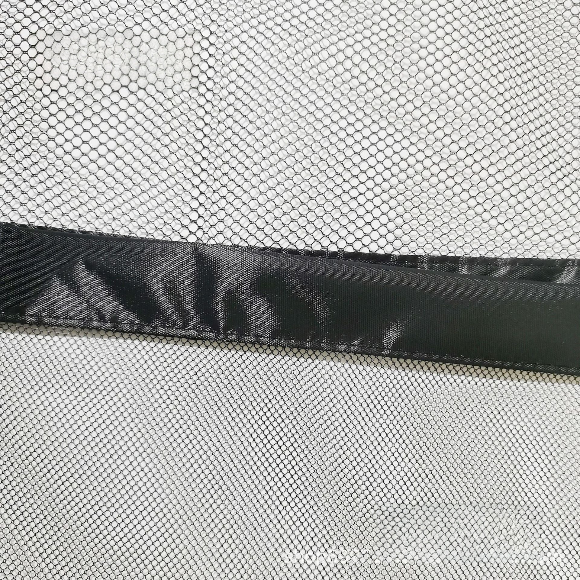 Portable mesh pet barrier net for doorways, detail and texture view