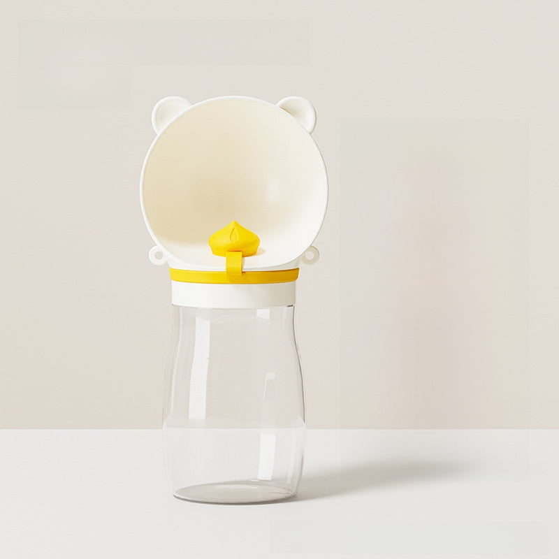 Portable dog water bottle in food-grade ABS, in a home setting