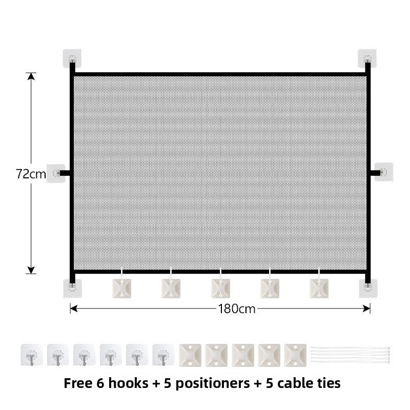 Foldable mesh pet gate barrier across a doorway
