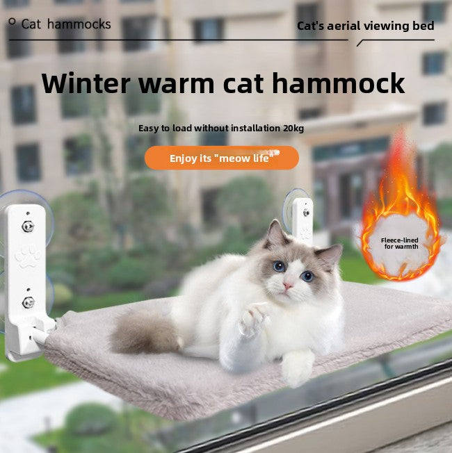 Hanging window cat bed attached with suction cups