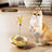 Self-Spinning Cat Turntable Toy with Feather Attachments and Weighted Tumbler Base
