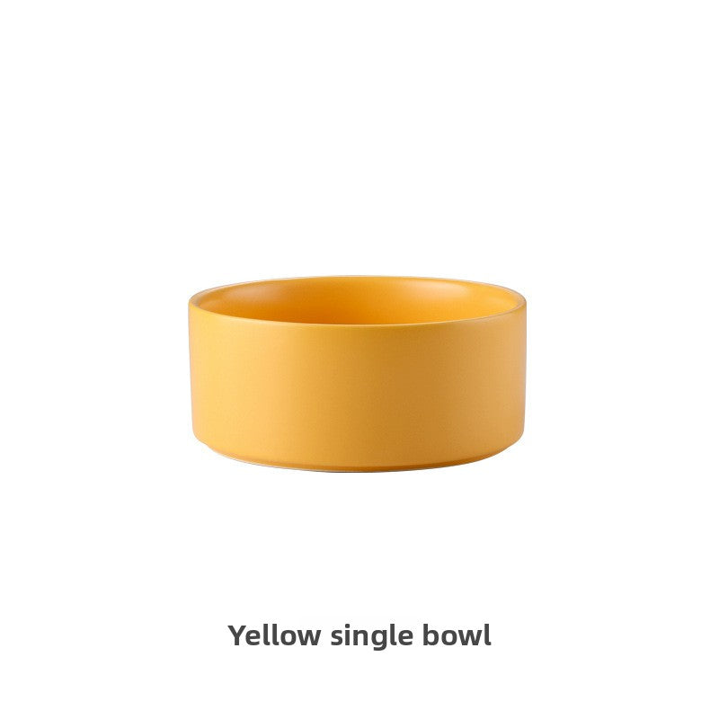 Ceramic cat bowl on a raised wooden stand in white