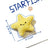 Small dog carrying a soft plush sea animal toy in its mouth - photo 3