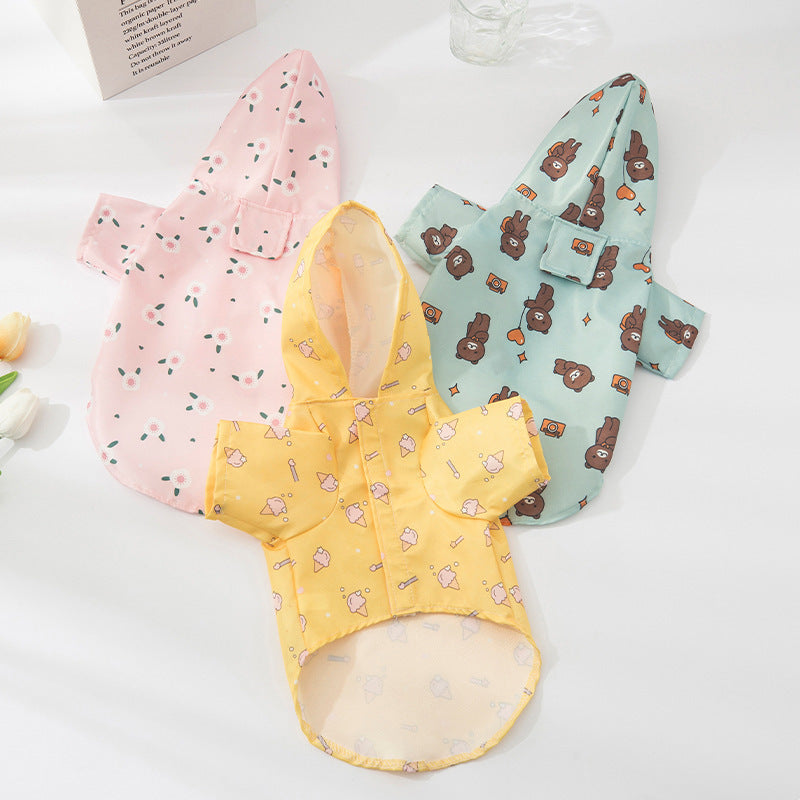 Waterproof dog raincoat with cartoon print in Travel Bear, in a home setting