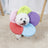 Soft sponge pet recovery collar in rainbow colours on a cat