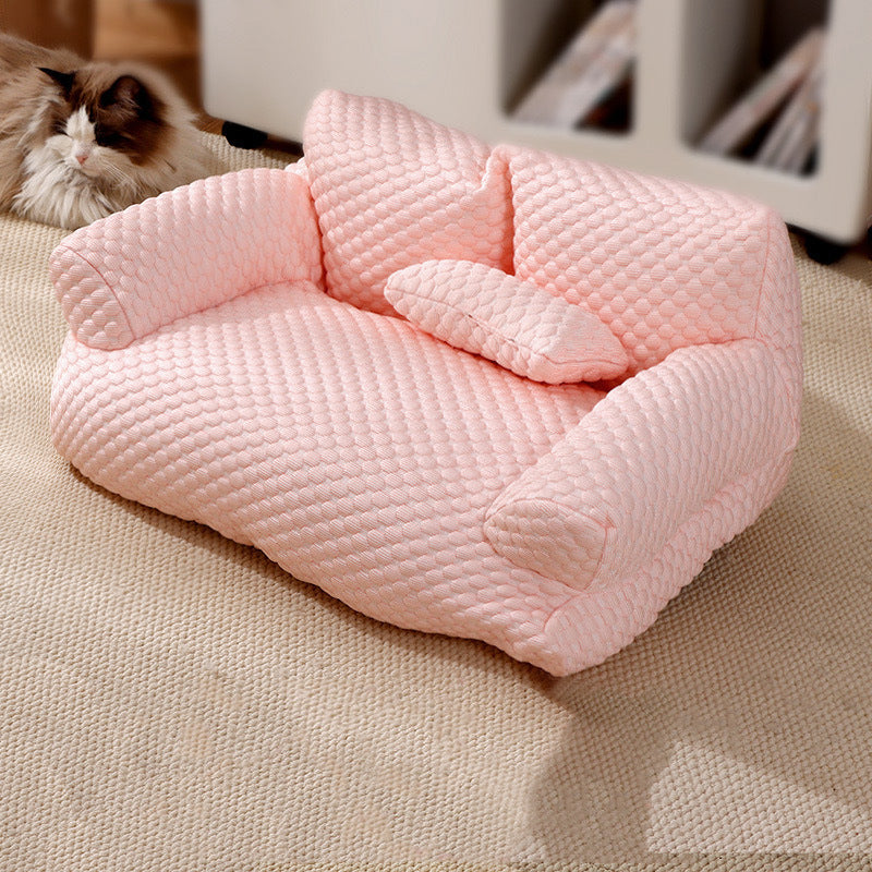 Cat sleeping on a grey washable dog sofa bed