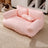Cat sleeping on a grey washable dog sofa bed