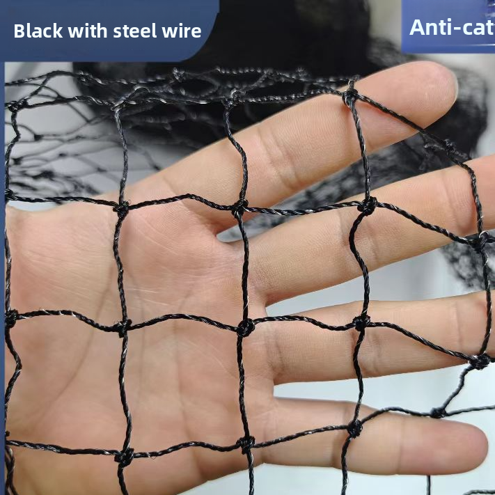 Cat sitting safely behind a balcony safety net