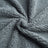 Waterproof double-sided pet blanket in grey on a sofa