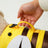 Adjustable dog swim vest with bee print in Dragonfly, in a home setting