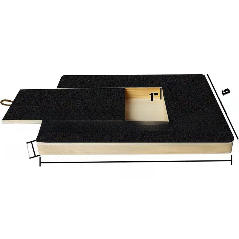 Cat scratching a flat wooden scratcher pad on the floor