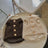 Faux lambswool pet vest with velvet lining in Apricot Latte, side view
