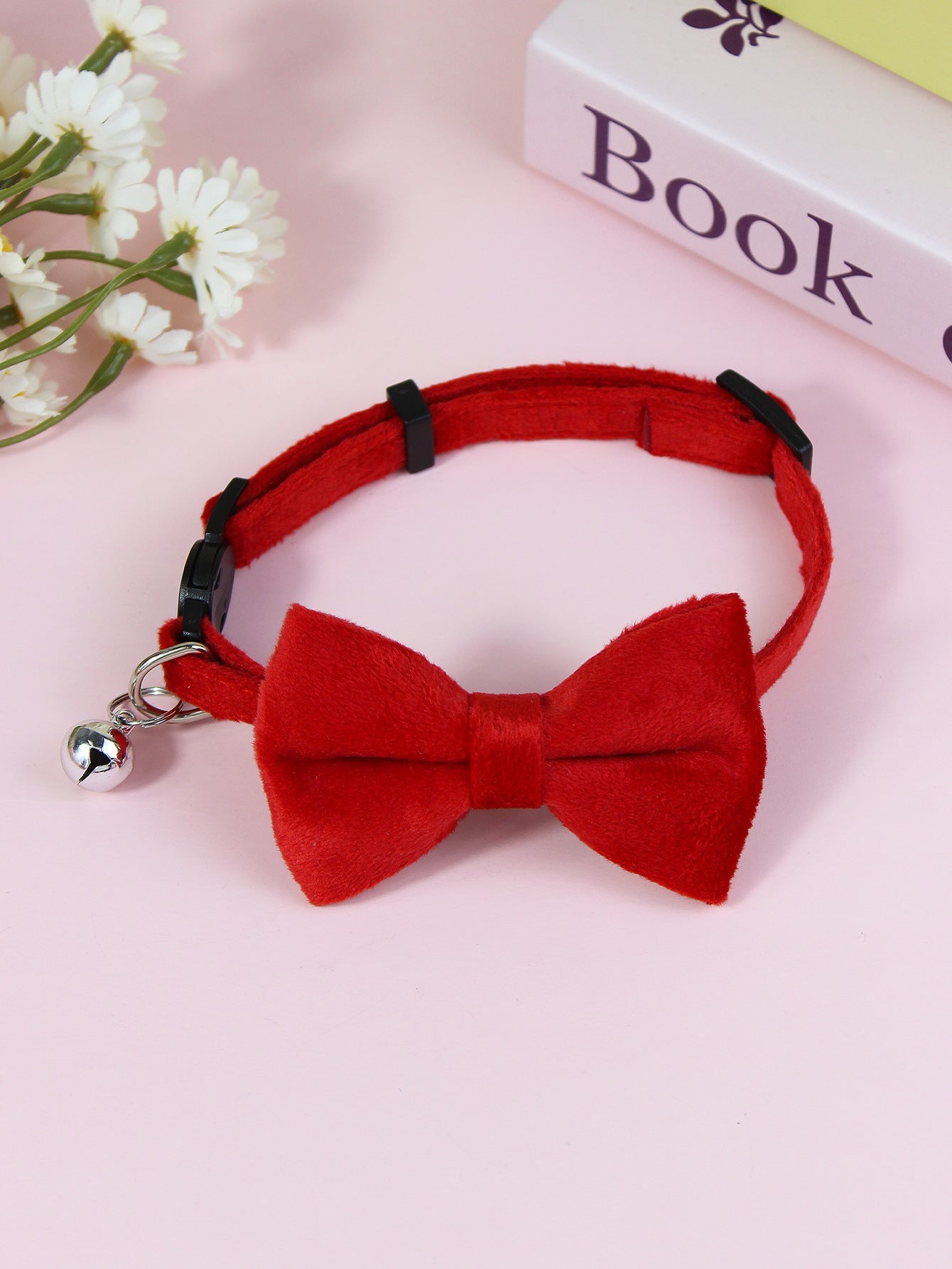 Striped cat collar with velvet bow, ideal for everyday use