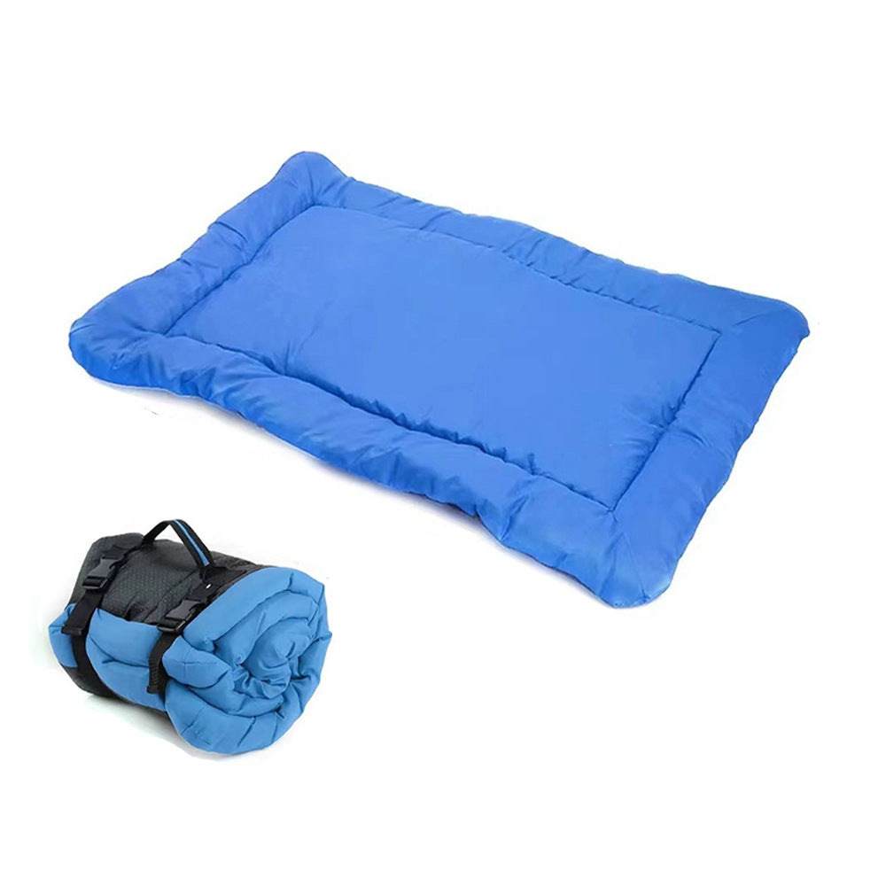 Army green foldable dog mat laid out on grass