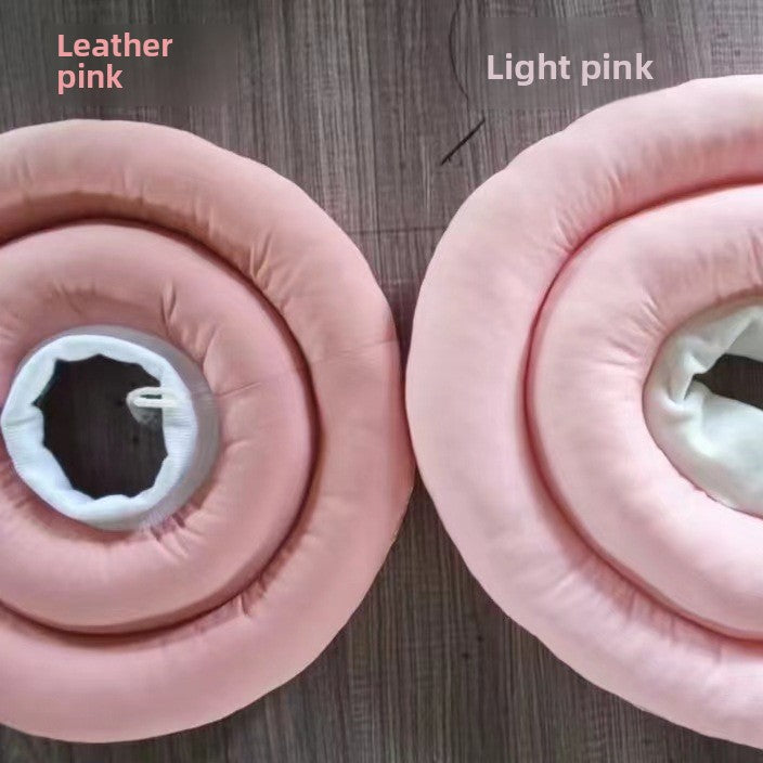 Soft padded recovery cone in light pink on a cat