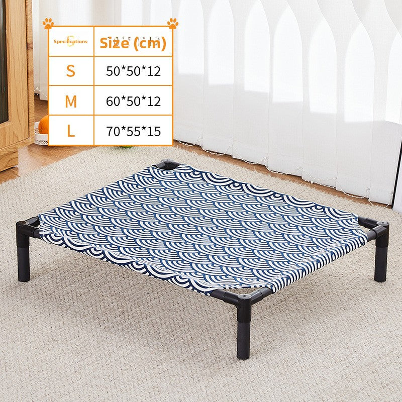 Small dog resting on an elevated bed with cyan alpaca pattern
