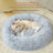 Plush round padded dog and cat bed, shown in 38 colours and styles