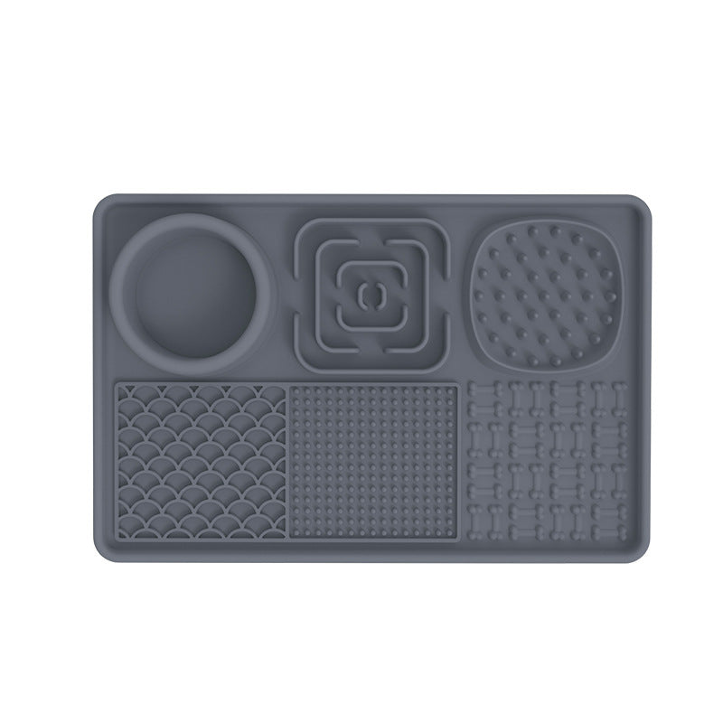 Dog licking a rectangular silicone slow feeder mat
