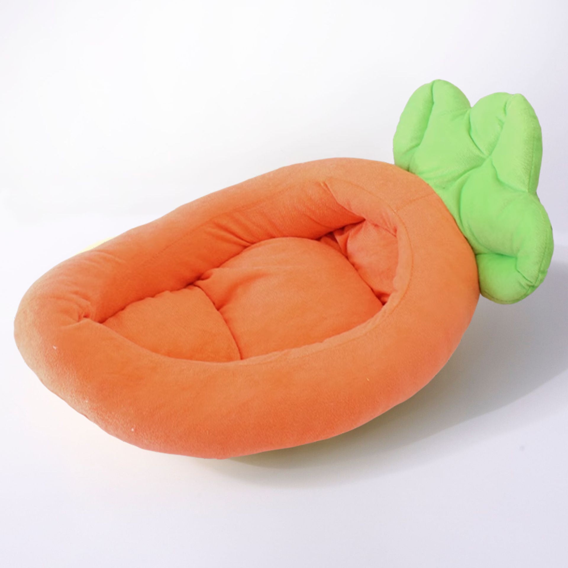 Kitten sleeping in a yellow banana cat bed with heart bone pillow
