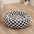 Plush round pet bed in check and floral prints, full product photo