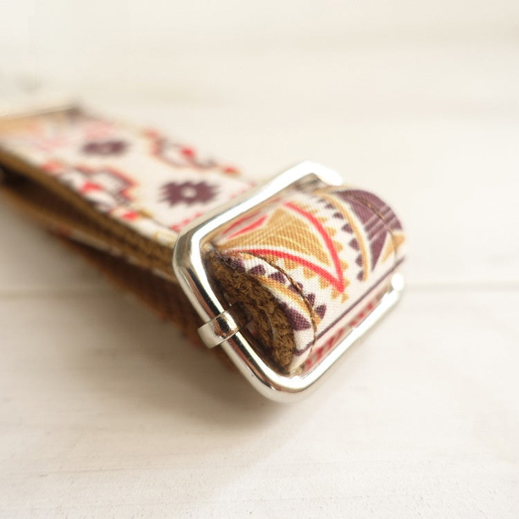Soft padded dog collar with traditional flower design in brown