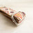 Soft padded dog collar with traditional flower design in brown
