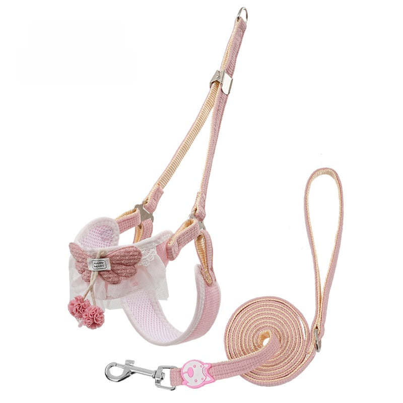Floral vest harness and lead set in pink on a small dog