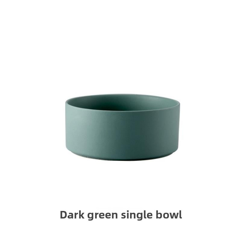Raised glazed ceramic pet bowl on a stand in pastel yellow, view 9
