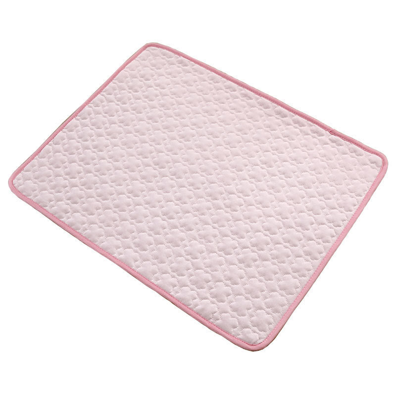 Cat stretched out on a grey breathable cooling mat