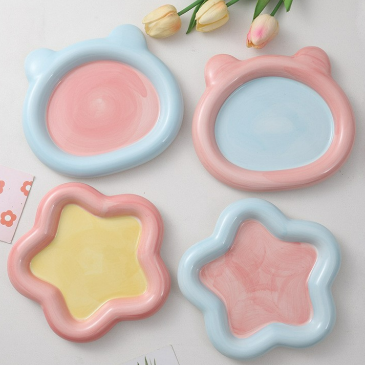 Glazed ceramic pet food plate with bear design in blue and pink, view 1
