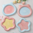 Glazed ceramic pet food plate with bear design in blue and pink, view 1