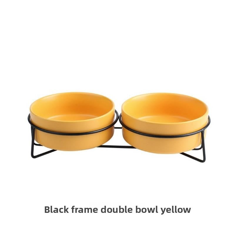 Raised glazed ceramic pet bowl on a stand in pastel yellow, view 6