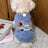 Small dog wearing a pink thick fleece cartoon vest