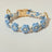 Handmade woven boho pet collar with pearl flowers in Green, in a home setting
