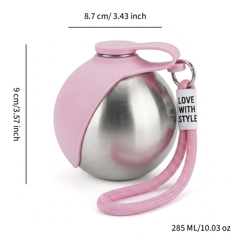 Stainless steel dog water bottle with hook in Pink Bottle, in use with a pet