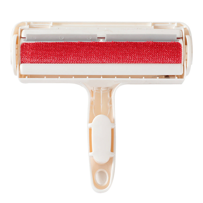 Cat ear pet hair remover brush lifting hair from a sofa