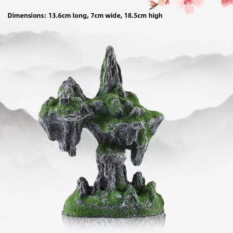 Fish swimming past a snow mountain rock decoration
