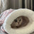 Warm enclosed cat sleeping bag bed, close-up detail view
