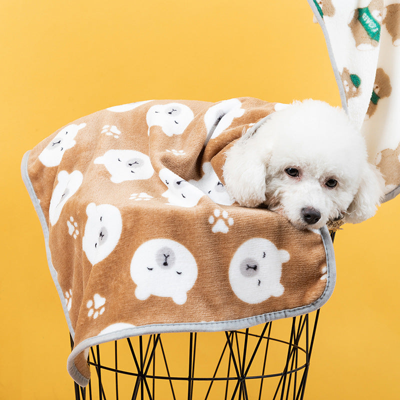 Soft flannel pet blanket with navy paw print