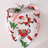 Small dog wearing a pretty floral print triangle pet bandana