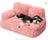 Small dog sleeping on a peach pink velvet pet sofa bed